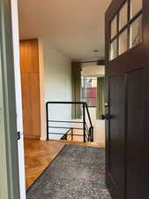 Hallway with an upstairs landing and baseboards