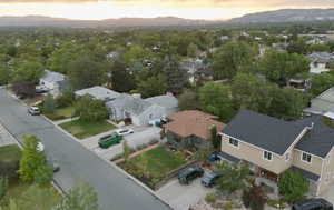 Aerial perspective of suburban area with a mountainous background