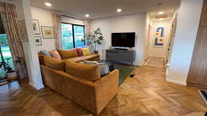 Living area featuring recessed lighting and baseboards