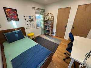 Bedroom with wood finished floors