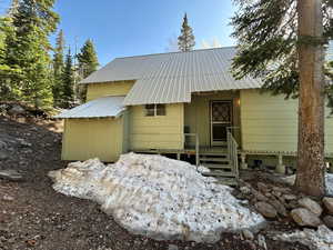 View of front of home with a metal roof