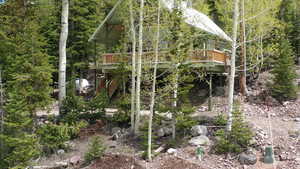 View of outbuilding with a wooded view