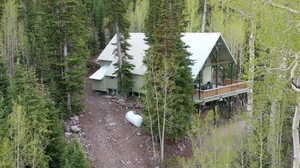 View of subject property featuring a heavily wooded area