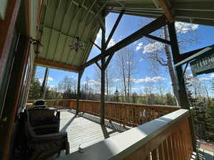 Wooden terrace with view of scattered trees