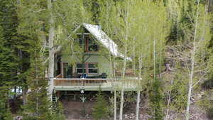 Back of property with a deck