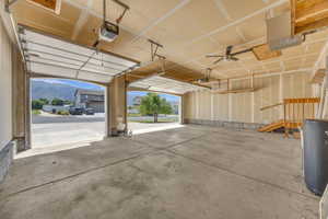 Garage with a garage door opener and a mountain view
