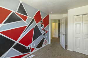 Corridor featuring carpet and a textured ceiling