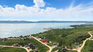 Aerial overview of property's location featuring a water and mountain view and property boundaries highlighted