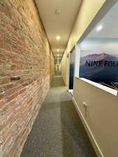 Hallway with carpet and recessed lighting