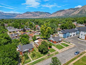 Aerial perspective of suburban area with a mountainous background