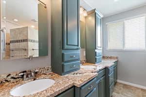 Full bath with vanity and recessed lighting