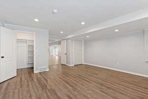 Basement featuring wood finished floors and recessed lighting