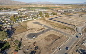 Aerial view of property's location with a mountainous background
