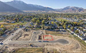 View of property location featuring property boundaries highlighted, a mountain backdrop, and nearby suburban area