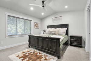 Bedroom featuring light colored carpet, vaulted ceiling, ceiling fan, and recessed lighting