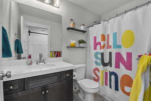 Bathroom featuring vanity and a shower with shower curtain
