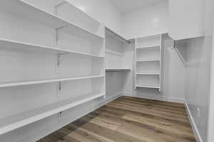 Spacious closet with wood finished floors