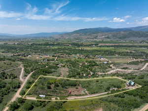 View of rural area featuring property boundaries highlighted and a mountain backdrop