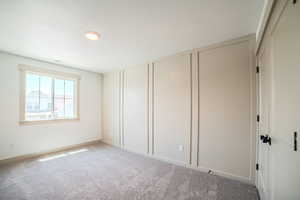 Unfurnished bedroom featuring carpet floors
