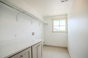 Laundry room featuring cabinet space and washer hookup