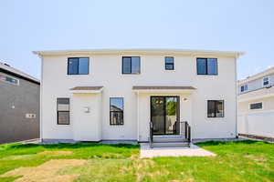 Back of property with stucco siding