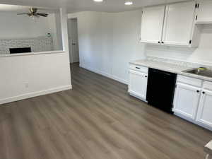 Kitchen with dishwasher, white cabinets, light countertops, ceiling fan, and recessed lighting