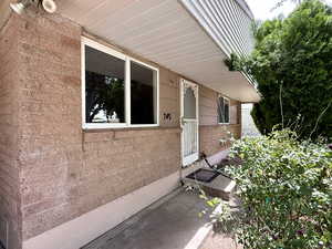 Property entrance with brick siding