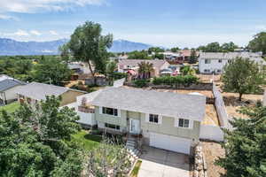 Aerial view of residential area with a mountain backdrop