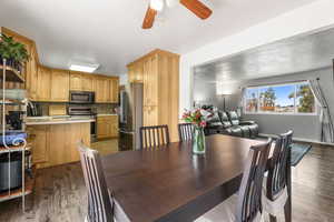 Dining room with a ceiling fan and light wood finished floors