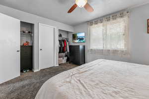 Bedroom featuring carpet and ceiling fan