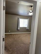 Master Bedroom entrance with ceiling fan and a textured ceiling