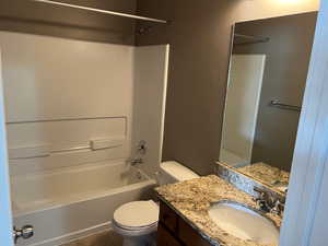 Full bathroom featuring shower / tub combination, vanity, and tile patterned flooring