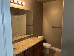 Master Bathroom with vanity, a shower, and a tub to relax in