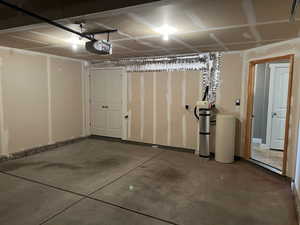 Garage featuring a garage door opener