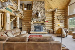 Oversized living room with large stone fireplace