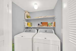 Laundry room with washing machine and dryer