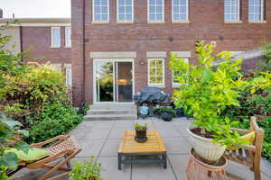 View of patio / terrace with a grill and entry steps