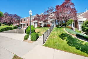 View of front facade with a front lawn and a residential view