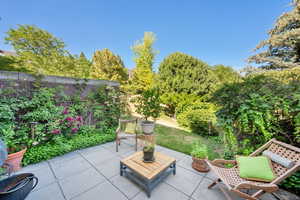 Fenced backyard featuring a patio