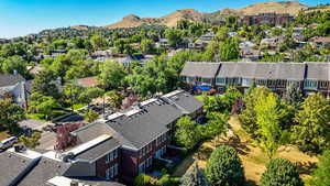 Aerial perspective of suburban area featuring a mountain backdrop