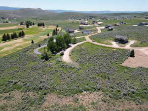 Aerial view of sparsely populated area featuring a mountain backdrop