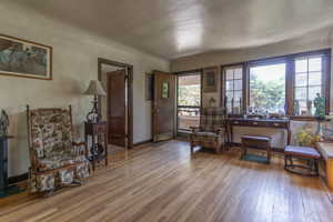 Living area featuring hardwood / wood-style floors and baseboards