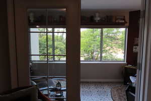 Doorway to outside with tile patterned floors