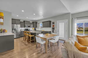 Dining space with light wood-style flooring, recessed lighting, and a mountain view