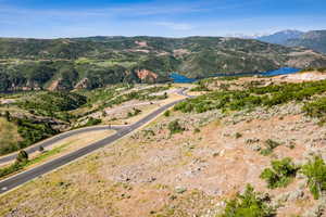 Mountain view featuring a nearby body of water