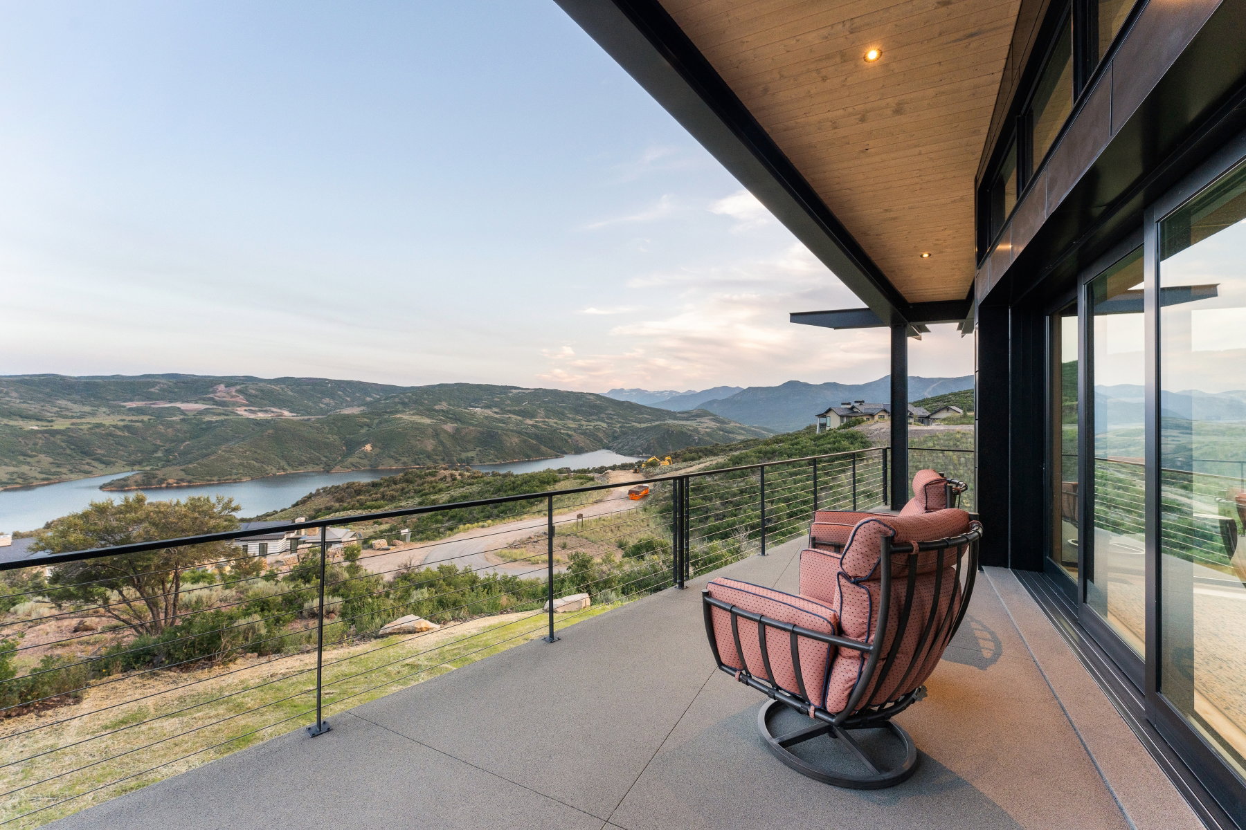 Balcony with a water and mountain view