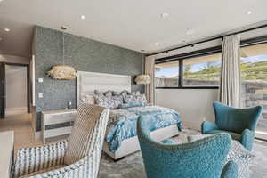 Bedroom featuring multiple windows and recessed lighting