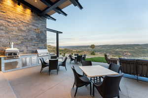 View of patio / terrace with outdoor dining area and exterior kitchen