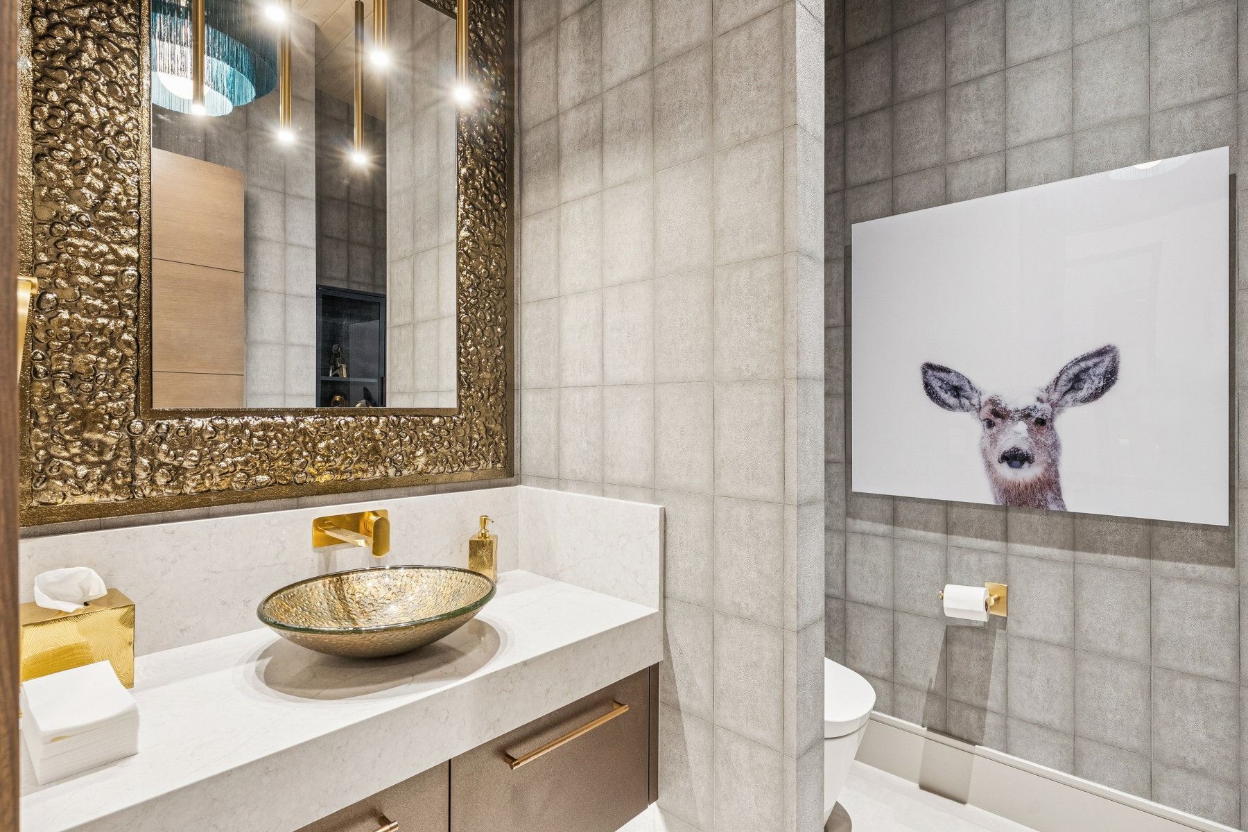 Bathroom featuring tile walls, vanity, and decorative backsplash