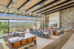 View of patio with outdoor lounge area, a mountain view, and outdoor dining space